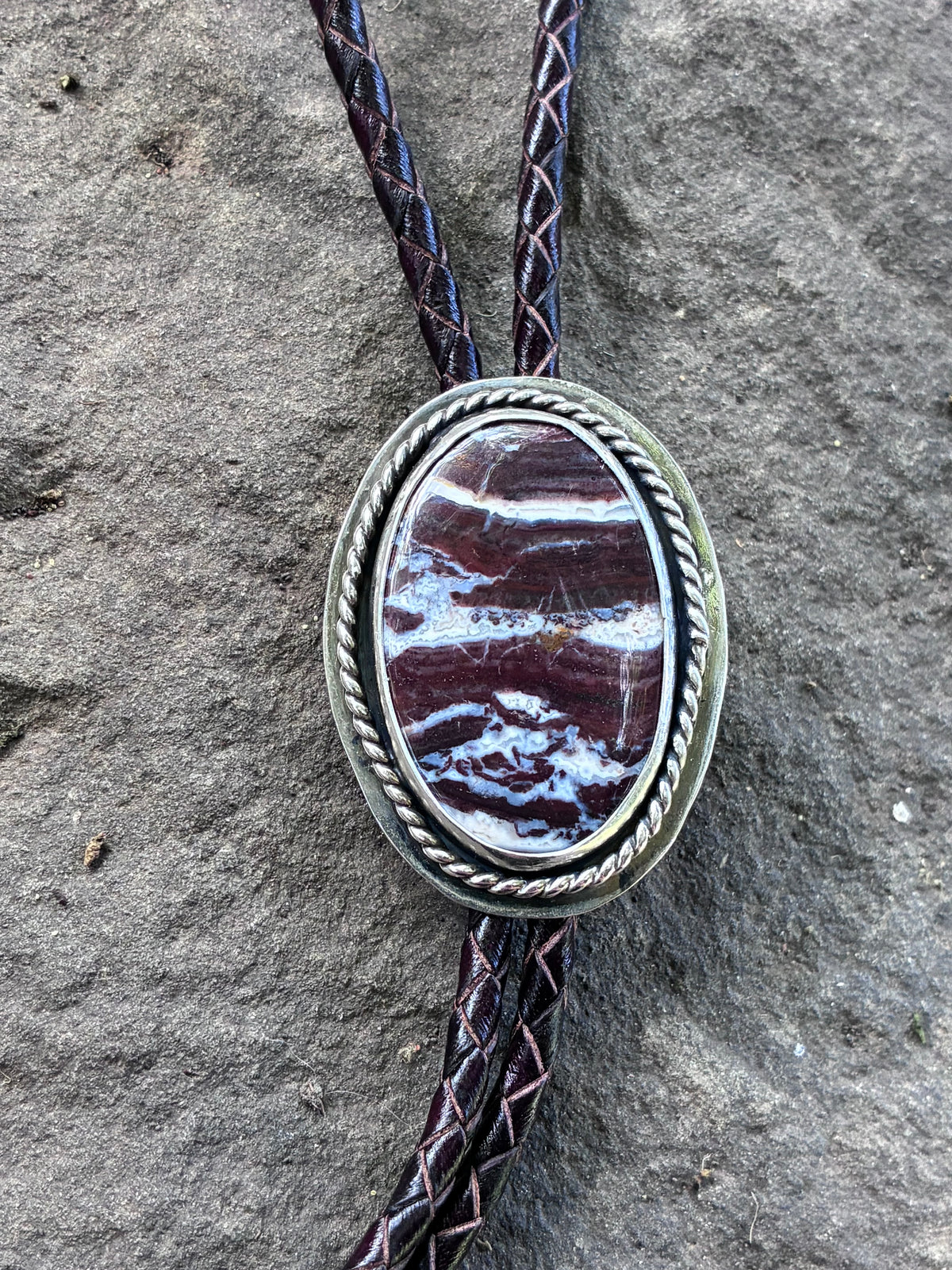 Close-up of Red Creek Jasper sterling silver bolo tie